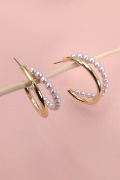 A statement of gold pearl and gold metal hoop earrings and elegance into your look with these eye-catching double-row hoop earrings. This will look great with your rompers or puff hem dresses.DIMENSION length: 1.25"width: 1.25" earring back: Postmetal finish: Gold Platingproduct: Lead & Nickel Compliantanti-tarnish: Double E-coating Trendy Gold Hoop Earrings With Pearls, Chic Pearl Hoop Earrings For Party, Double Hoop Earrings, Post Metal, Sunglass Chain, Faux Leather Belts, Steel Necklace, Gold Pearl, Monogram Initials