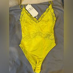 Green Bodysuit Yellow Fitted Bodysuit For Summer, Fitted Yellow Bodysuit For Summer, Yellow Lined Bodysuit For Spring, Yellow One-piece Bodysuit For Spring, Fitted Yellow Bodysuit For Spring, Yellow Stretch Bodysuit For Party, Yellow Bodysuit With Lined Body For Spring, Spring Yellow Bodysuit With Lined Body, Yellow Spring Party Bodysuit