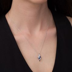 Create a sensation with this stunning three-stone pendant. Crafted in sterling silver, this marvelous design showcases a trio of graduated-size lab-created bright blue sapphires - the largest a 3.5mm stone - suspended diagonally in an elegant bypass frame. Buffed to a brilliant luster, this pendant suspends along an 18.0-inch rope chain that secures with a spring-ring clasp. Blue Teardrop Pendant Jewelry With Diamond Accents, Blue Teardrop Pendant With Diamond Accents, Sapphire Heart Pendant Birthstone Jewelry, Fine Jewelry Sapphire Teardrop Pendant, Fine Jewelry Sapphire Three Stone, Fine Jewelry Blue Three Stone Jewelry, Sapphire Teardrop Pendant Fine Jewelry, Fine Jewelry Sapphire Heart Pendant, White Gold Sapphire Heart Pendant Jewelry