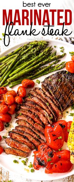 the best ever marinated flank steak with tomatoes and asparagus on a white plate