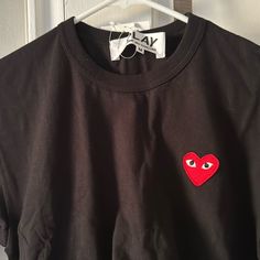 Brand New Comme Des Garon Tee With Tags Black Cotton T-shirt With Heart Graphic, Black Long Sleeve T-shirt With Heart Graphic, Black Tops With Heart Graphic And Short Sleeves, Black Short Sleeve Top With Heart Graphic, Black Graphic Tee Shirt With Heart Design, Black Graphic Tee Shirt With Heart Graphic, Black Crew Neck Shirt With Heart Graphic, Black Graphic Tee With Heart Graphic, Black Short Sleeve Shirt With Heart Graphic