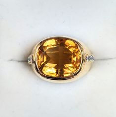 14 KT Gold Approximately 6.0 Ct CITRINE and .30 Ct Diamond Ring Size 5.75 Approximate Gem Weight: Citrine - 6.0 Ct/ Diamond - 0.30 Ct Center Stone: 13mm x 11mm Total Weight: 7 DWT/ 10.9 Grams Please see our photos. Our shipping includes USPS First Class Mail with Insurance and Delivery Confirmation. Making an Offer? Thank you! Please note this policy: We review offers *ONLY* on weekdays during business hours (Monday - Friday, 9am - 5 pm). Classic Yellow Gold Topaz Ring With Gemstone Accents, Formal Citrine Ring With Diamond Accents, Yellow Gemstones With Accents Fine Jewelry, Classic Yellow Sapphire Ring For Formal Occasions, Classic Yellow Sapphire Gemstone Jewelry, Classic Citrine Jewelry With Gemstone Accents, Formal Citrine Cushion Cut Ring, Classic Yellow Sapphire Diamond Ring, Formal Cushion Cut Citrine Ring