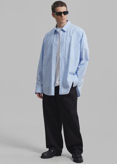 Color: Sky Crisp cotton poplin Oversized fit Pointed collar Double breast pockets Curved hem Front button closure Button cuffs 100% Cotton Dry Clean Imported One Size Oversized Shirt, Cotton Poplin, Oversized Fits, Double Breasted, Dry Clean, Collar, How To Wear, Color