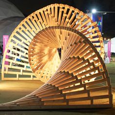 a large wooden object sitting on top of a field