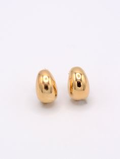 Get ready to elevate your earring game with our Big Bean Studs. These bold and fun studs are a popular style, adding a touch of classic clean style to any outfit. With their unique design, you're sure to turn heads and make a statement. We also love them paired with the Baby Beans as a second piercing pair. Sold as a pair. Earring back included. Metal: 14K Gold Vermeil or Sterling Silver Second Piercing, Love Lock, Morse Code Bracelet, Moms Favorite, Jewelry Case, Earrings Collection, Layered Look, Earring Backs, Huggies Earrings