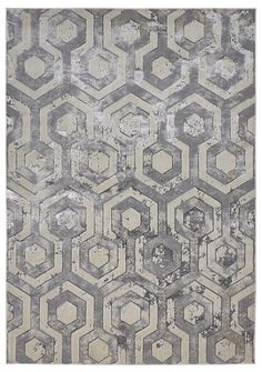 an area rug with grey and white hexagonals