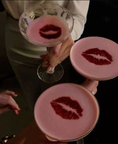 three wine glasses with red lips painted on them