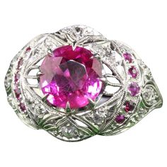 Beautiful Antique Art Deco Platinum Burma Pink Sapphire and Diamond Filigree Engagement Ring - GIA. This gorgeous engagement ring is crafted in platinum. The center holds a natural pink sapphire with a GIA report. It is set in a beautiful Art Deco filigree mounting with old cut pink sapphires and diamonds. The ring is in great condition with crisp engravings going around the ring as well. The center pink sapphire has a beautiful bubble gum color and really pops! Item #R1782 Metal: Platinum Weight: 6.9 Grams Size: 7 1/2 Sapphire: 2.67 ct - Burma NO HEAT - GIA # 6223981058 Diamonds: Approximately .20 cts Color: H Clarity: VS2 Side Pink Sapphires: Approximately .10 cts Measurements: Top of the ring measures 15.66 mm wide and band measures 2 mm wide. Measurements off the finger: 7.55 mm high L Filigree Engagement Ring, Gorgeous Engagement Ring, No Heat, Antique Art Deco, Jewelry Rings Engagement, Antique Art, Pink Sapphire, Bubble Gum, Ring Verlobung