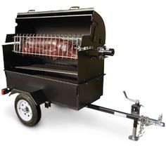 an outdoor bbq grill on wheels with the door open and meat cooking in it