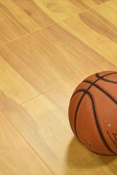 basketball sitting on vinyl wood grain court floor tiles Ja Morant Style, Wallpaper Cover, Basketball Court Flooring, Basketball Rules, Gym Floor, Indoor Basketball Court, Indoor Basketball, Basketball Birthday, Basketball Workouts