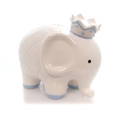 an elephant figurine with a crown on it's head is shown in front of a white background