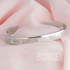 📍 This stylish Coordinates Cuff Bracelet, handcrafted from 925 sterling silver, features a personalized engraving of your chosen coordinates.  Perfect as a coordinates gift for marking a special location or occasion! The adjustable bangle design ensures a comfortable fit for any wrist, making it an ideal piece of personalized jewelry.  Whether you're looking for a unique Christmas gift or a thoughtful boyfriend gift, this engraved bracelet is a standout choice for both men and women.  📏 Size & Materials: Style: Custom Coordinates Cuff Bracelet Materials: 925 Sterling Silver, 24K Gold Plated Thickness: 1.8mm (0.6") bracelet Width: 8mm (0.25") Sizes: 140mm (5.5") 155mm (6.5") 170mm (7.5") ✍️ How to Order: When placing your order for this personalized engraved wristband, provide your coordi Engraved Bangle Bracelet For Personalized Gift, Personalized Sterling Silver Name Bracelet Bangle, Personalized Sterling Silver Name Bangle, Personalized Engraved Sterling Silver Bracelet, Silver Stainless Steel Bracelets With Engraving Option, Hand Stamped Sterling Silver Cuff Bangle, Adjustable Engraved White Gold Bangle, Silver Stainless Steel Bangle For Anniversary, Silver Stainless Steel Anniversary Bangle