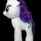 a white stuffed pony with purple hair