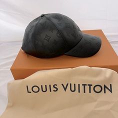 The Monogram Shadow Cap Elevates A Much-Loved Baseball Style To New Heights. Expertly Crafted From 100% Leather And Embossed With A Monogram Shadow Pattern, The Five-Panel Visor Cap Is A Testament To Louis Vuitton's Leatherwork Expertise. This Sleek Accessory Features An Adjustable Back Strap And Matches The Permanent Monogram Shadow Line Of Leather Goods. Black Hat With Logo Print And Flat Brim, Luxury Baseball Cap With Logo And Curved Brim, Designer Black Cap, Black Visor Hat With Logo Print, Designer Black Baseball Cap With Curved Brim, Luxury Baseball Cap With Curved Brim And Logo, Designer Adjustable Black Baseball Cap, Luxury Logo Baseball Cap With Curved Brim, Luxury Snapback Hat With Logo