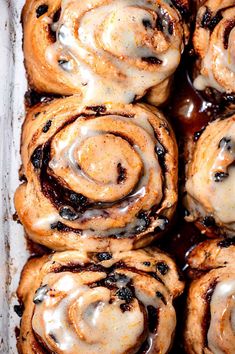 cinnamon rolls with icing in a baking pan