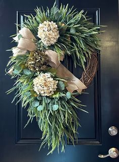 a wreath is hanging on the front door