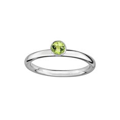 Round-cut peridot stone emits shimmering green hues. Details: 4-mm width Rhodium-plated sterling silver Size: 5. Color: Grey. Gender: female. Age Group: adult. Green Birthstone Ring With Round Gemstone, Fine Jewelry Green Stackable Birthstone Rings, Modern Peridot Rings For Anniversary, Green Solitaire Stackable Rings, Fine Jewelry Green Birthstone Stackable Rings, Green Birthstone Stackable Rings, Formal Peridot Birthstone Ring For May, Stackable Peridot Gemstone Rings For May Birthstone, Green Solitaire Stackable Rings For May Birthstone