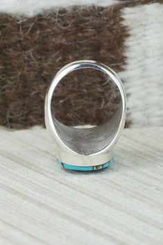 This turquoise and sterling silver inlay ring was made by Zuni silversmith Amy Wesley. The inside is signed Amy.Size: 10Length: 1 1/8"Width: 5/8"Free shipping on all orders! We ship with USPS and always include tracking. All orders ship within a day of payment.Returns are accepted up to 30 days after you receive your order. Just send us a message. Our shop offers cash back or store credit. The item must be returned in the same condition. Oval Turquoise Ring With Sterling Silver Inlay, Anniversary Turquoise Inlay Ring In Sterling Silver, Western Style Turquoise Ring With Sterling Silver Inlay, Silver Turquoise Ring With Inlay, Artisan Silver Turquoise Ring With Inlay, Western Style Turquoise Inlay Ring In Sterling Silver, Sterling Silver Turquoise Inlay Jewelry, Luxury Sterling Silver Turquoise Inlay Ring, Native American Jewelry