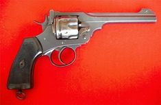 an old revolver on a red background