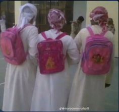 three women in white dresses with pink backpacks