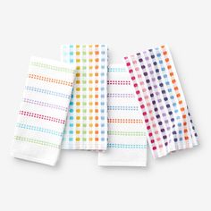 four napkins with different colored dots on them