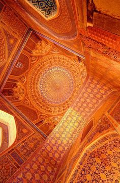 an intricately decorated ceiling in the middle of a building