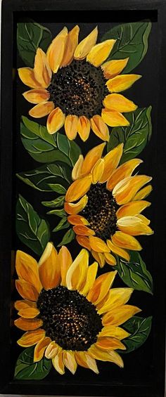 a painting of three yellow sunflowers with green leaves on a black background, painted in acrylic paint