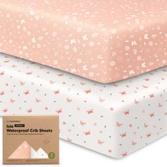 two sheets with pink and white flowers on them