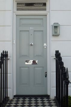 the front door is painted gray and black