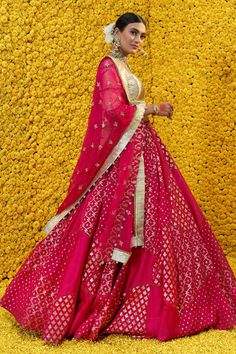 Hot pink banarasi chanderi lehenga with embroidered waistband, tassel detail, cutwork panels and floral woven motifs. Comes with tassel detailed golden blouse and organza embroidered dupatta.
Component: 3
Pattern: Woven,Embroidered
Type Of Work: Floral
Neckline: Sweetheart
Sleeve Type: Elbow Sleeves
Fabric: Banarasi Chanderi,Shantoon,Organza
Color: Pink
Other Details: 
Tassel detail
Woven motifs
Organza dupatta
Back cutout
Occasion: Wedding - Aza Fashions Chanderi Lehenga, Mahima Mahajan, Golden Blouse, Embroidered Dupatta, Organza Dupatta, Elbow Sleeve, Sweetheart Neck, Bridal Lehenga, Cut Work