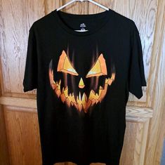 Very Cool T-Shirt And Ready For The Halloween Spooky Black T-shirt For Fall, Black Pre-shrunk T-shirt For Fall, Black Short Sleeve T-shirt For Halloween, Black Graphic Tee With Glow In The Dark Details, Black Short Sleeve Glow In The Dark T-shirt, Halloween Orange Crew Neck T-shirt, Halloween Orange Graphic Print T-shirt, Orange Halloween Graphic T-shirt, Halloween Glow In The Dark Black Top