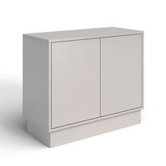 a white cabinet sitting on top of a floor