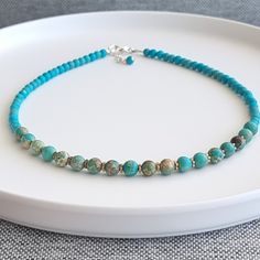 Turquoise beaded necklace with turquoise and sterling silver accents. This beautiful piece is a great way to add a touch of class and sophistication to any outfit. The necklace is handmade with genuine turquoise, and sterling silver,  creating a stunning look sure to get compliments.   Size:  34.5 cm + ( 3 cm)  13.58 inches Features: ❤ Gemstone beads ❤ Handmade item ❤ All my jewelry is sent in a beautifully decorated box (perfect for a gift) Visit my shop: https://www.etsy.com/shop/PassionByMaya Turquoise Beaded Necklace, Turquoise Choker, Turquoise Bead Necklaces, Handmade Jewelry Tutorials, Necklace Turquoise, Beads Handmade, Genuine Turquoise, Green Necklace, Silver Accents