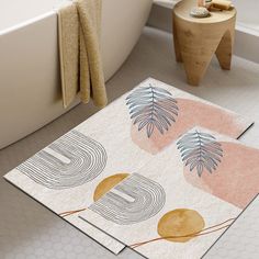 a bathroom with two rugs on the floor and a bathtub in the background