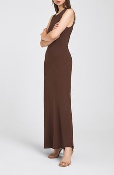 This lightweight woven dress is cut in a sleeveless silhouette with a floor-grazing length that makes a simple yet dramatic statement. Back keyhole with button-and-loop closure Jewel neck Sleeveless Lined 100% viscose Dry clean Imported Sleeveless Brown Maxi Dress For Formal Occasions, Brown Sleeveless Maxi Dress For Formal Occasions, Formal Stretch Sleeveless Slip Dress, Sleeveless Solid Bias Cut Dress, Sleeveless Solid Dress With Bias Cut, Sleeveless Solid Color Bias Cut Dress, Solid Sleeveless Bias Cut Dress, Formal Sleeveless Brown Maxi Dress, Sleeveless Solid Slip Dress With Bias Cut