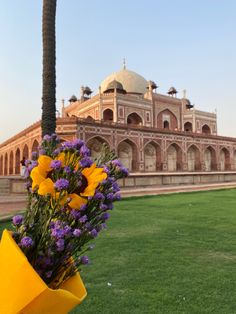 flowers are placed in front of a building