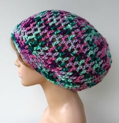 "In colors of berries and mints (green), soft and vegan suitable. Open stitch snood with gaps for stretch and airflow. Let it sag in the back or tuck in your hair. Moderate shorter length for any kind of hair, locks, straight or braided, wrangle your locks on a bad hair day! This hat is not suitable for long or thick dreadlocks, should for sure hold short or starter dreads and long straight hair tucked inside, please check measurements to ensure a good fit. Width at brim 19\", stretches to 24\", Purple Crochet Beanie For Beach, Knitted Beanie For Beach, One Size Fits Most, Slouchy Multicolor Beanie Hat, Small Dreads, Hand-knitted Purple Crochet Beanie, Hippie Shorts, Multicolor Beanie For Beach, One Size, Womens Slouchy Beanie, Slouch Beanie Hats