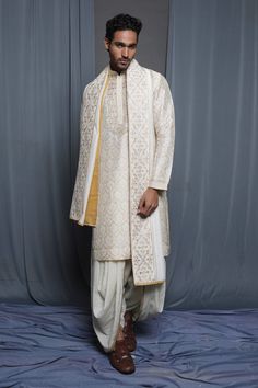 Ecru chanderi stole with floral embroidered border.
Pattern: Embroidered
Type Of Work: Floral
Fabric: Chanderi
Color: Cream
Other Details: 
Note: Pant and kurta worn by the model is not for sale
 - Aza Fashions Stole For Men, Types Of Work, Embroidered Border, Border Pattern, Not For Sale, Floral Fabric, Aza Fashion, Krishna, Cream