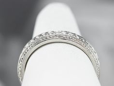 A beautiful platinum band for wearing as a wedding ring, this would make a great stacking ring, as well! The pattern is pretty, what we call a wheat pattern, and is classic for the era. Metal: Platinum Width of Band: 3.8 mm Height off Finger: 2.1 mm Ring Size: 6.50 Marks: "90% PLAT CTI" Stamped on the inside band Classic Hallmarked Round Bands, Classic Round Hallmarked Bands, Classic Hallmarked Bands, Classic Stackable Engraved Ring, Timeless Engraved Ring With Decorative Band, Heirloom Engraved Stackable Ring For Formal Occasions, Heirloom Formal Band In Round Shape, Anniversary Platinum Stackable Rings, Formal Engraved Ring With Decorative Band