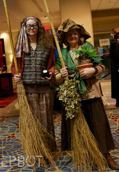 two people dressed in costumes standing next to each other