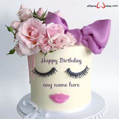 a birthday cake decorated with flowers and eyelashes