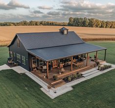 an aerial view of a house in the middle of a field