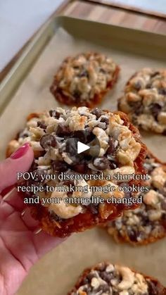 a person is holding up some cookies on a baking sheet with the words, how you discovered a shortcut recipe to make magic cookies and your entire life changed