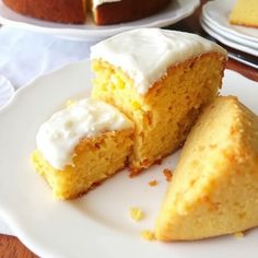 two pieces of cake sitting on top of a white plate next to another piece of cake