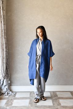 ODETTE kimono linen coat is an asymmetrical design with two deep side pockets. This linen jacket is elegant, comfortable and so versatile - the design is available in 3 sizes. ODETTE asymmetrical linen jacket is not only comfortable but also eco-friendly and sustainable, making it the perfect choice for anyone looking to reduce their environmental impact. ▶ FIT ODETTE linen duster is of loose design and we offer it in 3 sizes. ▸ The model is wearing size S/M, color Sea Blue ▶ FABRIC: 100% linen Kimono Linen, Linen Duster, Summer Coat, Asymmetrical Coat, Linen Kimono, Linen Coat, Summer Coats, Linen Cardigan, Linen Summer