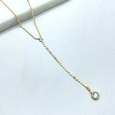 18k Gold Filled 1mm Box Chain with Clear Cubic Zirconia Detail and Long Drop Necklace, Wholesale Jewelry Making Supplies. Necklace Size: -Length: 1mm / Thickness: 1mm Cylinder:  -Length: 3.2 inches / Thickness: 2mm CZ Big: 5mm                CZ Small: 4mm 💎 With new products daily, quality and competitive  prices, in DiJu Jewelry you find the most unique styles of modern designs, always looking for elegance and market trends.   *Helping your Jewelry Businesses Grow *Starting your Own Business *Making your Own Collection: DiJu Jewelry ever brings Better Moments for your Life.   📲 Find many more styles in our DiJu Jewelry Etsy Store. https://www.etsy.com/shop/DJDiJuJewelry   💎 You can choose from unique styles of earrings, necklaces, pendants and charms, bracelets, anklets, rings, chokers Gold Cubic Zirconia Jewelry With Box Chain, Gold Cubic Zirconia Box Chain Necklace, Gold Diamond Necklace With Box Chain For Anniversary, Gold Cubic Zirconia Diamond Cut Chain Necklace, Gold Delicate Chain Necklace With Cubic Zirconia, Long Drop Necklace, Market Trends, Solid Gold Jewelry, Necklace Size