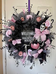 Large 28 inch black and white poly mesh wreath with pink accent faux roses. A large 16 inch skeleton wearing a fancy tall hat with pink and black decor sits mischievously on one end of the wreath surrounded  by glitter ball picks in black and pink and black ribbon swirl picks Pink Halloween Wreaths & Garlands, Pink Black And White Halloween Decor, Pink And Black Halloween Wreath, Pink Black Halloween Decor, Pink And Black Wreath, Pastel Halloween Wreath, Pink Halloween Wreath, Gothic Wreaths