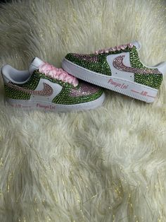 Bling Air force 1 are perfect for weddings, proms, homecomings, birthdays, special events or just your everyday girly girl. These pair are sure to turn heads with all the sparkle and shine.  These are hand painted then high-quality rhinestones are applied by hand. Colors shown are Pink & Green (AKA Sorority Colors)  PLEASE BE SURE OF YOUR SIZE BEFORE PLACING ORDER, DUE TO ITEM BEING CUSTOM AND MADE TO ORDER I DO NOT ACCEPT ANY REFUNDS NOR EXCHANGES IF YOU'RE NEED BY DATE IS CLOSE, PLEASE SEND ME A MESSAGE 1ST BEFORE PLACING ORDER TO MAKE SURE I AM ABLE TO COMPLETE IN A TIMELY MATTER RUSH ORDERS are available for a fee please message me 1st before placing order. Once an order is placed it CANNOT be CANCELLED, RETURNED, OR EXCHANGED ALL SALES ARE FINAL! Check us out on Instagram Like and fol Bling Air Force 1, Mickey Shoes, Sorority Colors, Aka Sorority, Surprise Az, Sneakers Athletic, Air Force Ones, Pink Rhinestones, Girly Girl