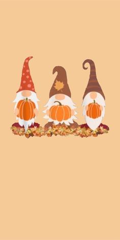 three little gnomes with pumpkins and leaves on a brown background, one wearing a red hat