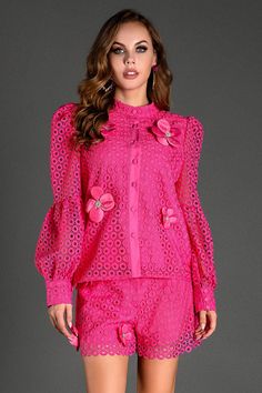 Step into a world of style with our long sleeve embroidered flower set. This stunning set features intricate floral embroidery on a bold fuchsia eyelet lace fabric, adding a touch of elegance and sophistication. The long sleeves and button-down top, paired with matching shorts, create a harmonious balance of style and comfort. Crafted from high-quality, breathable material, this set enhances your charm while ensuring you stay comfortable all day long. It's perfect for garden parties, summer soir Elegant Long Sleeve Tops With Floral Applique, Chic Pink Blouse With Floral Embroidery, Elegant Pink Tops With Floral Embroidery, Elegant Long Sleeve Blouse With Floral Applique, Elegant Spring Blouse With Floral Applique, Pink Long Sleeve Lace Blouse, Long Sleeve Pink Lace Blouse, Elegant Blouse With Floral Applique For Spring, Spring Floral Blouse